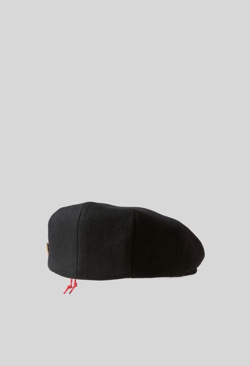 Wool beret with metal brooch