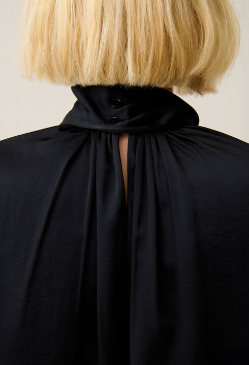 Flowing dress with black bow collar