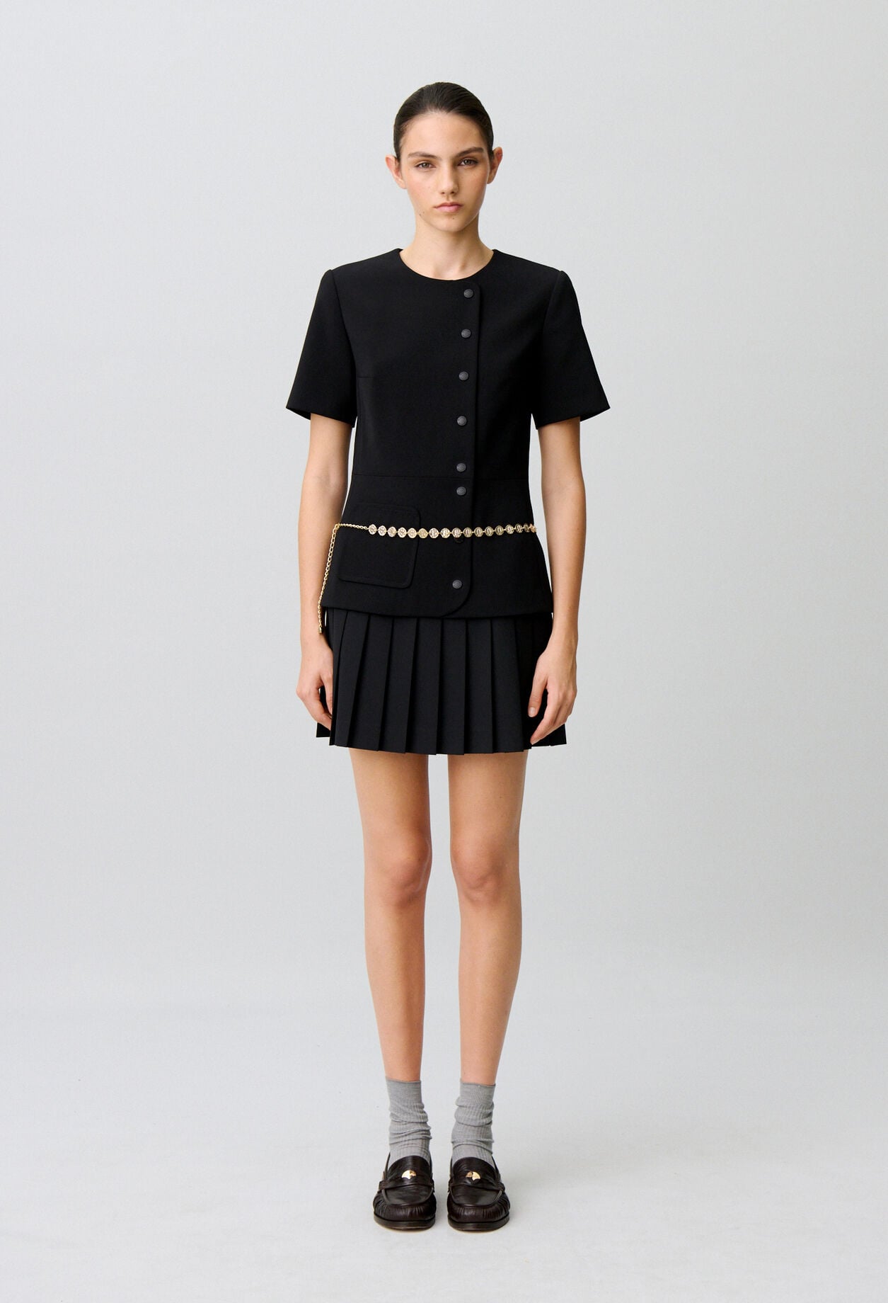 Short pleated peplum dress