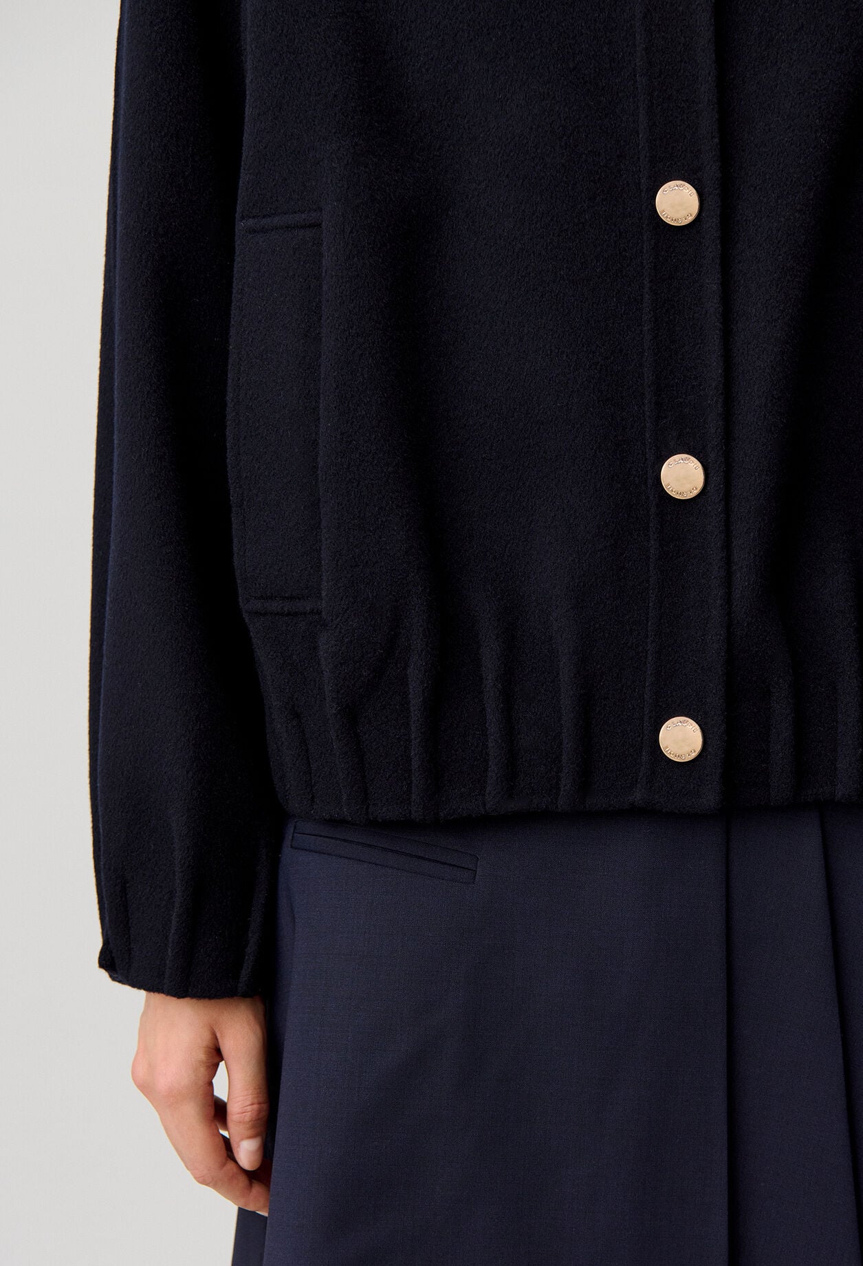 Oversized jacket with gold poppers
