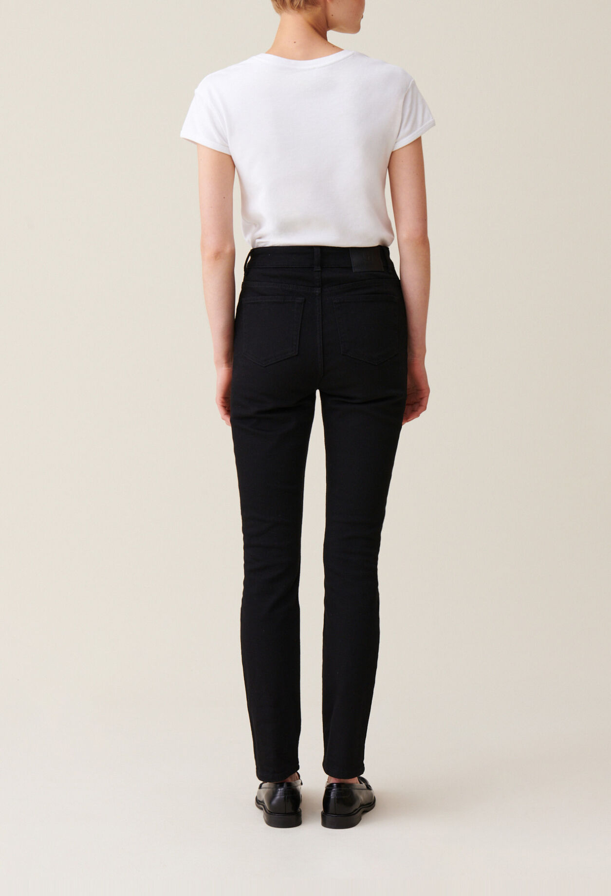 Black mid-rise slim jeans