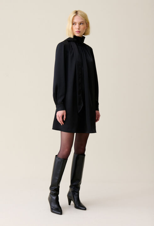 Flowing dress with black bow collar
