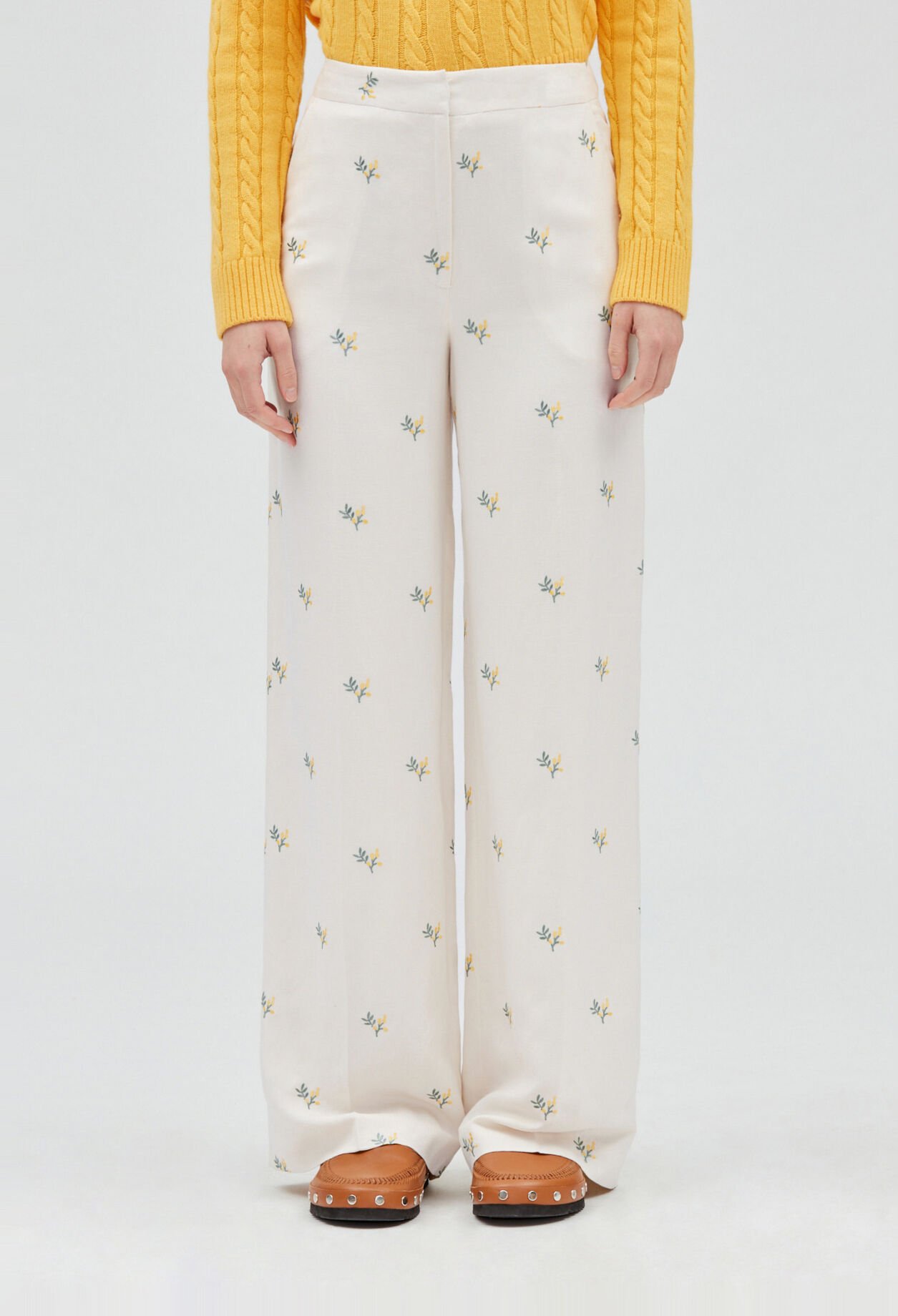Trousers with embroidered mimosa pattern