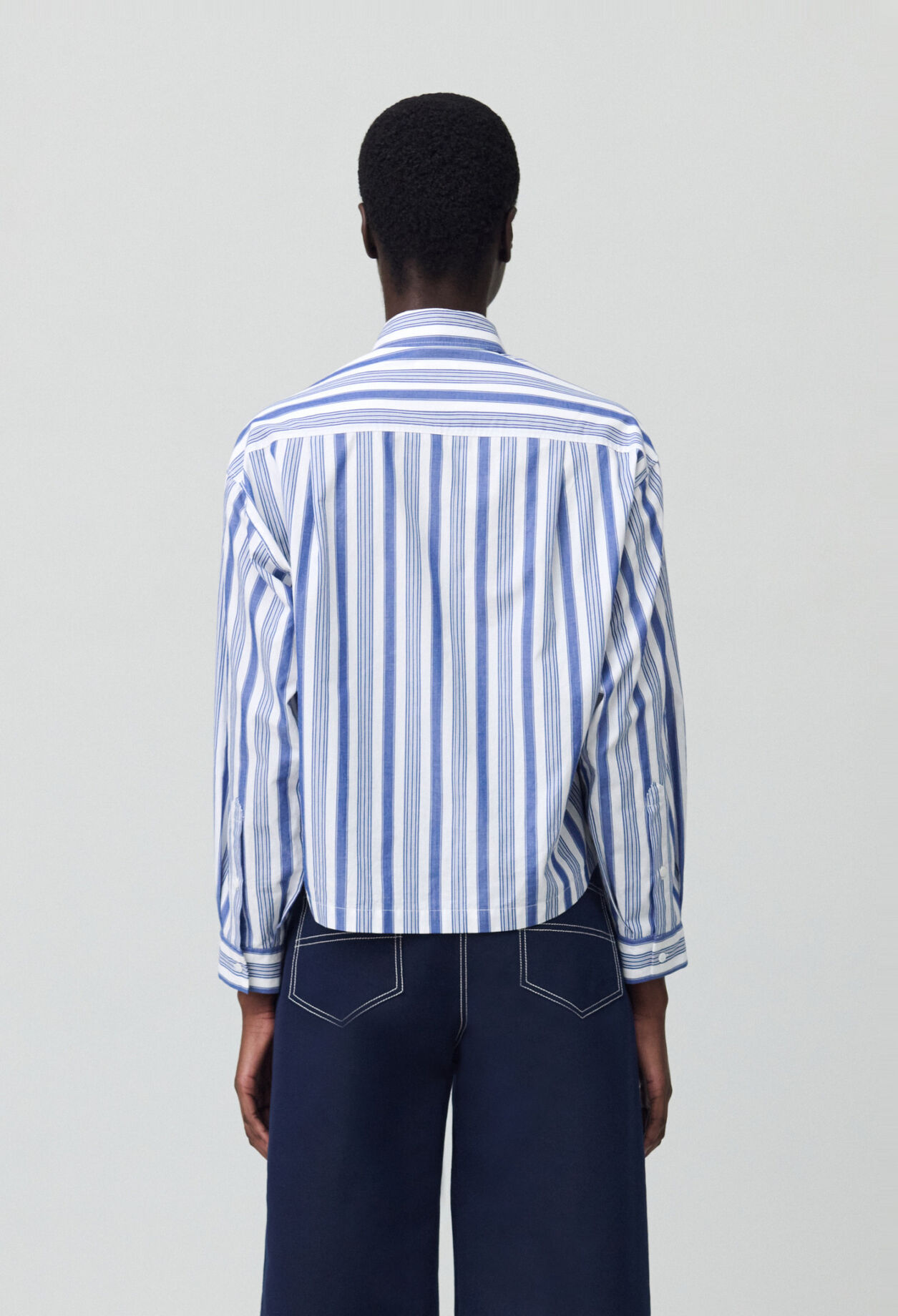 Striped shirt with bow collar
