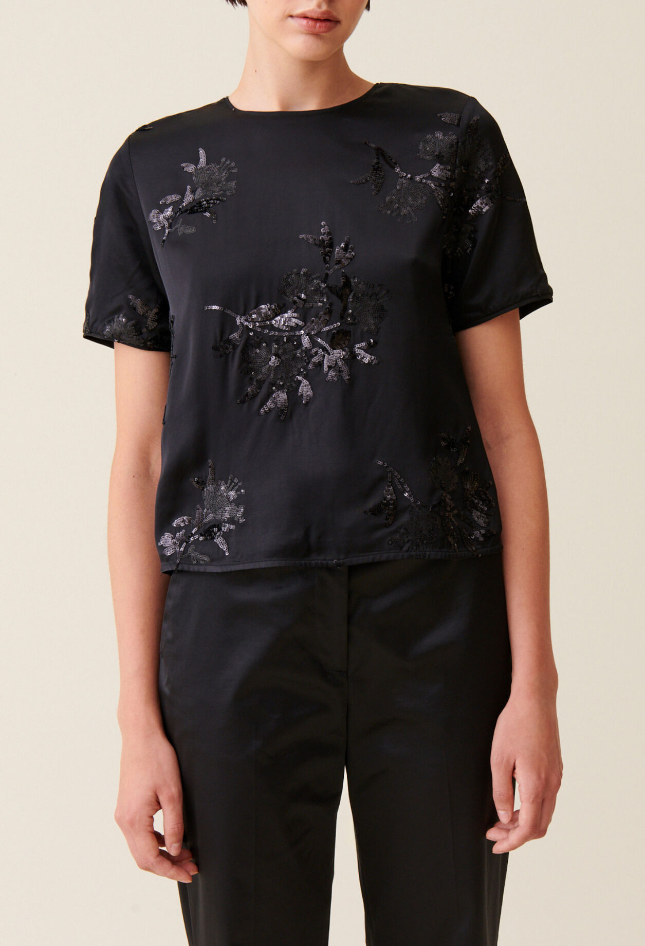 Black top with embroidered sequins