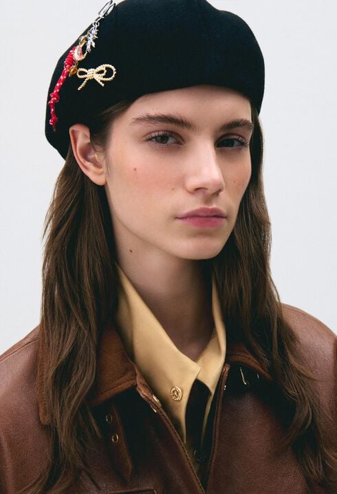 Wool beret with metal brooch