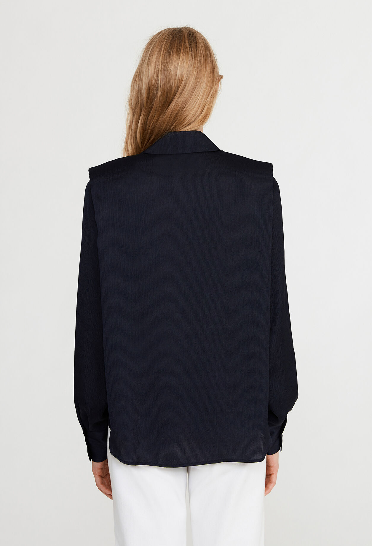 Shirt with shoulder pads