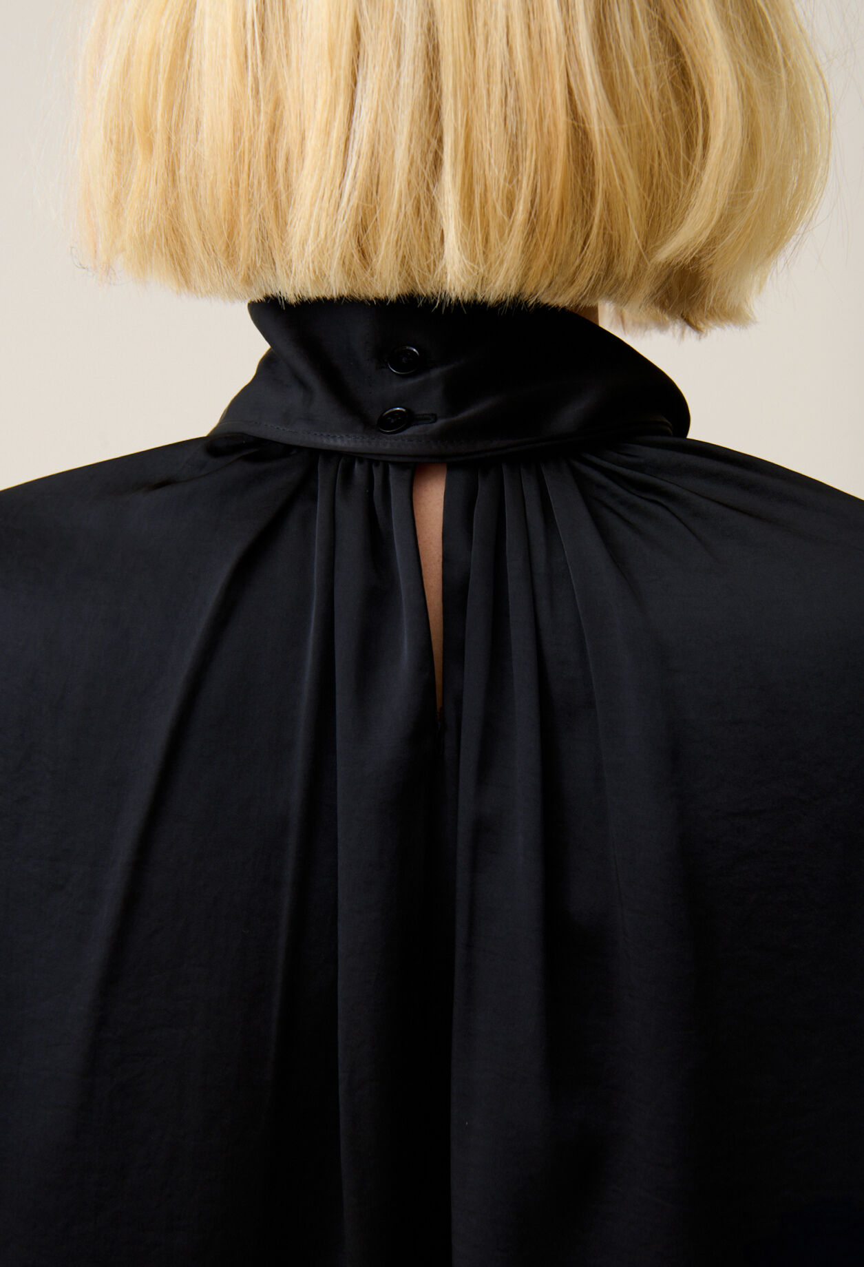 Flowing dress with black bow collar