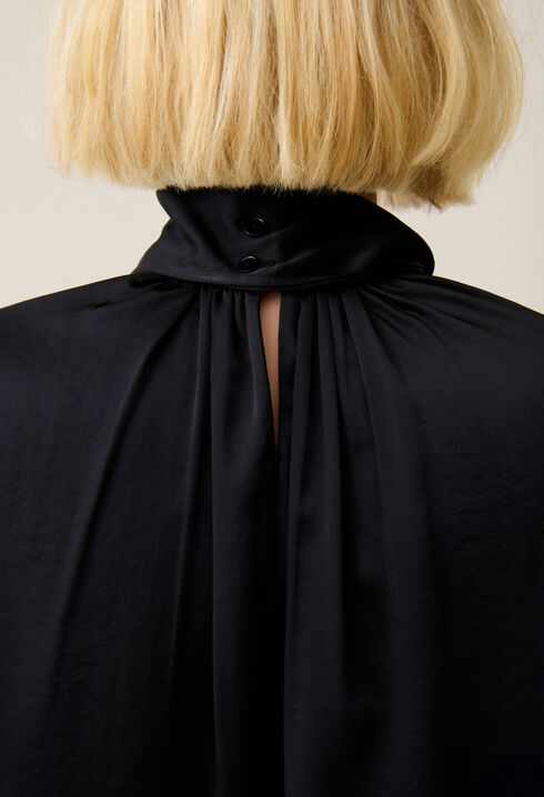 Flowing dress with black bow collar