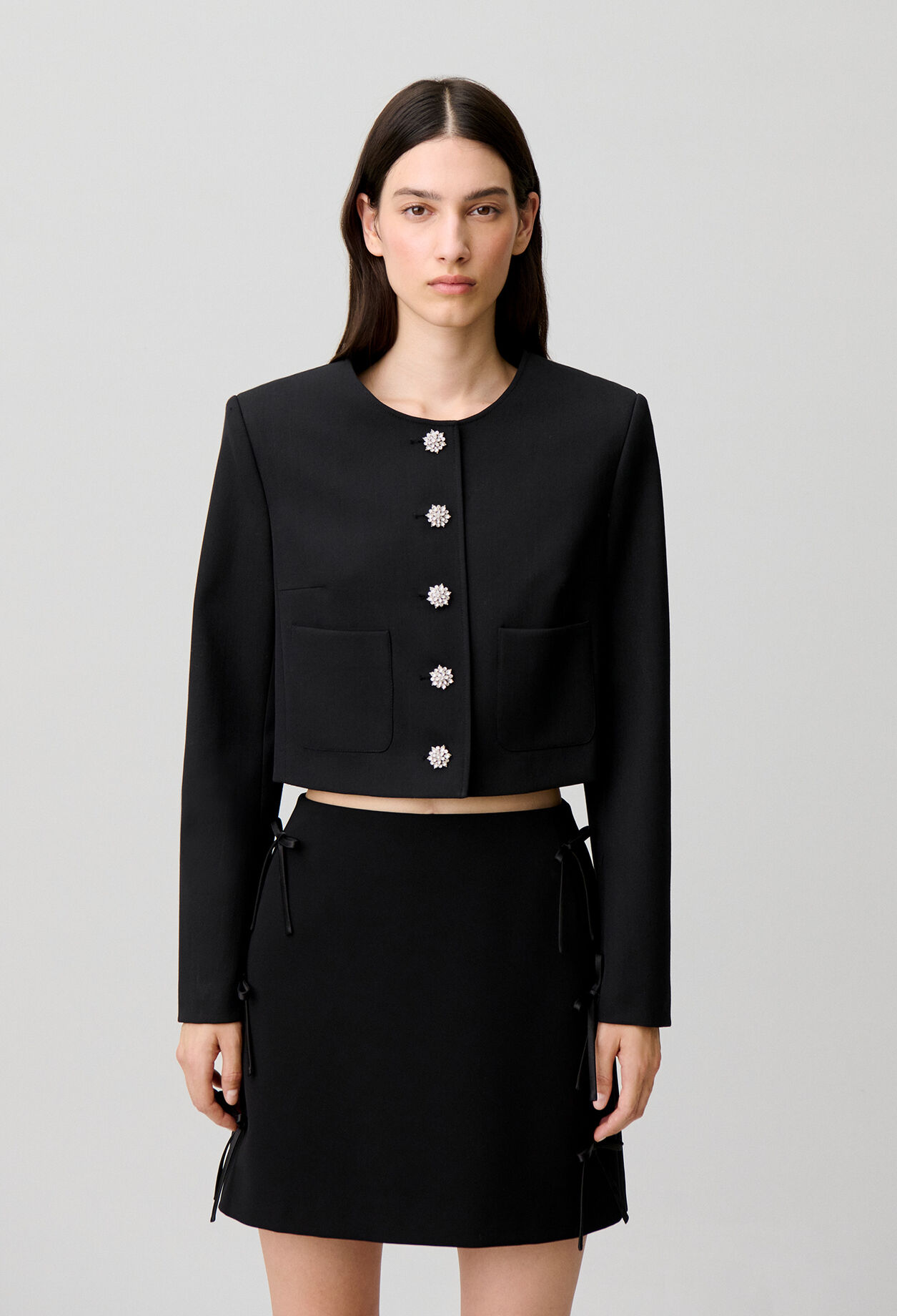 Short jacket with jewel buttons