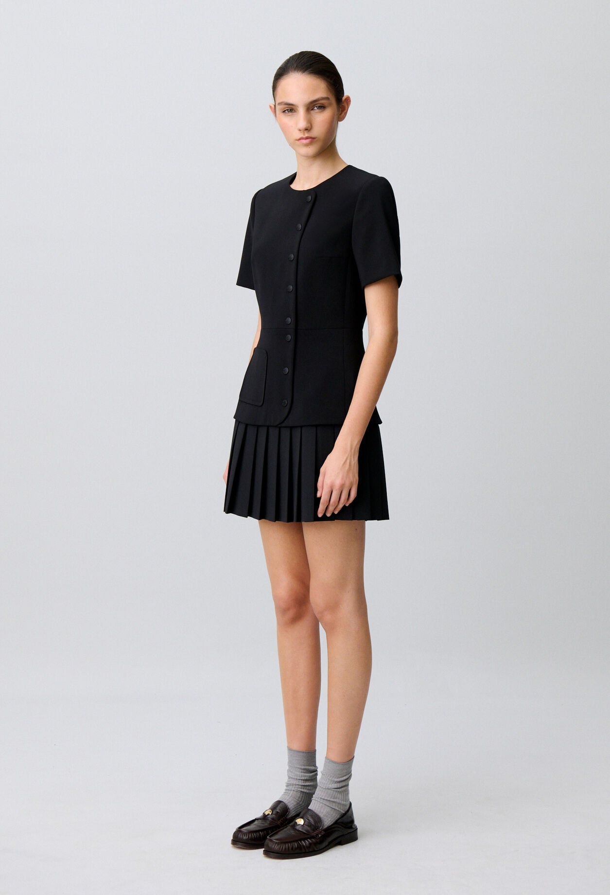 Short pleated peplum dress