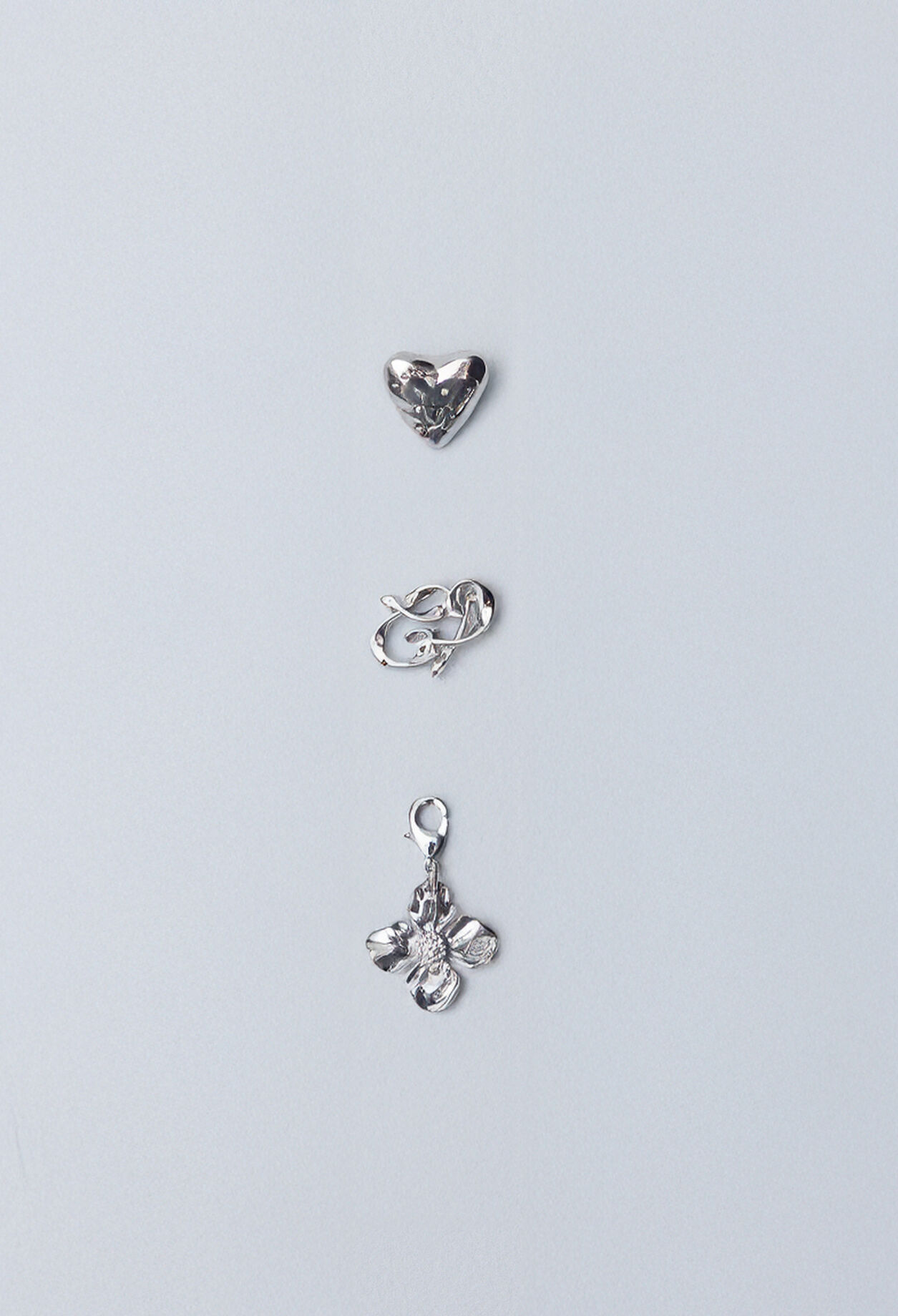 Silver flower charm