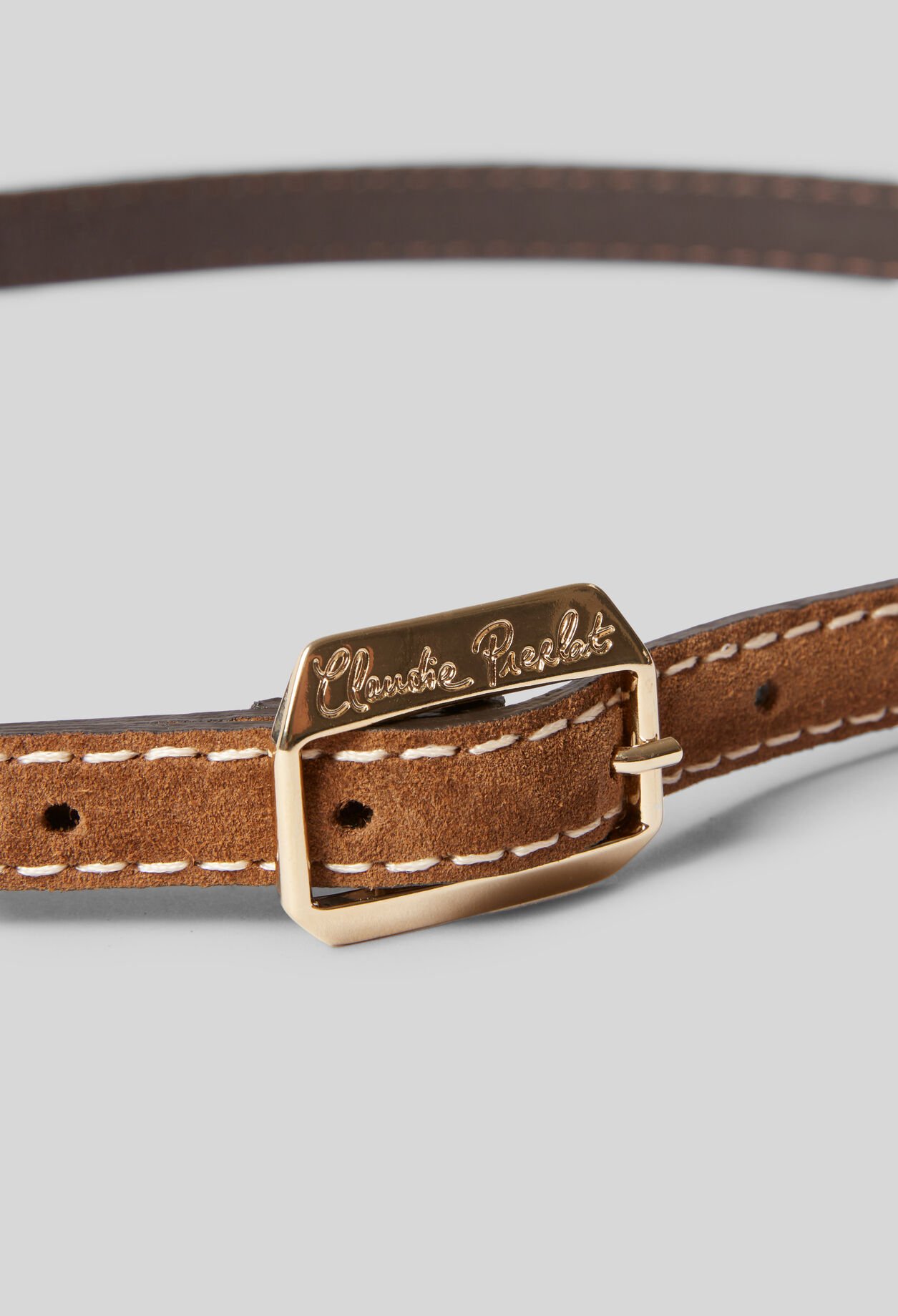 Suede belt with a gold buckle