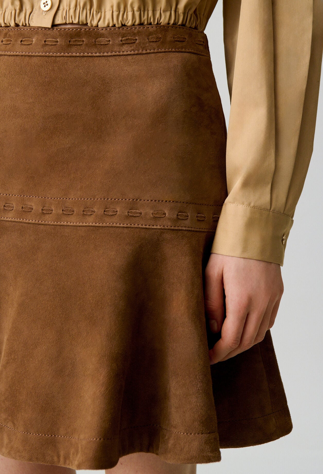 Short suede skirt