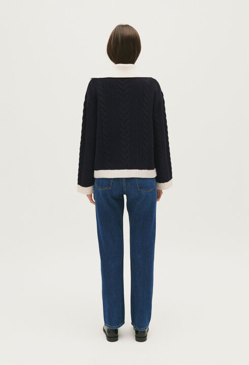 Navy blue cable-knit jumper