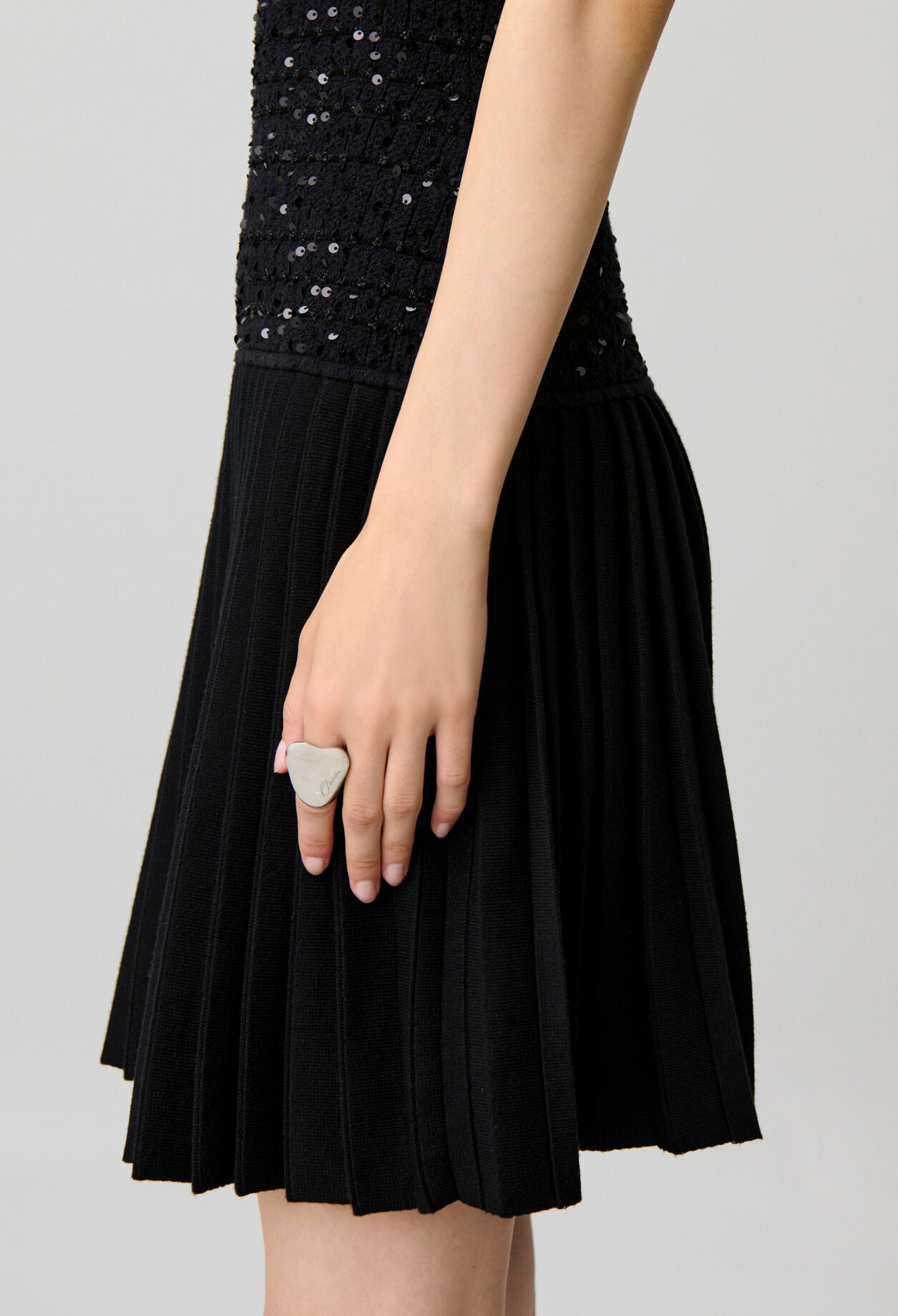 Short fitted sequinned knit dress