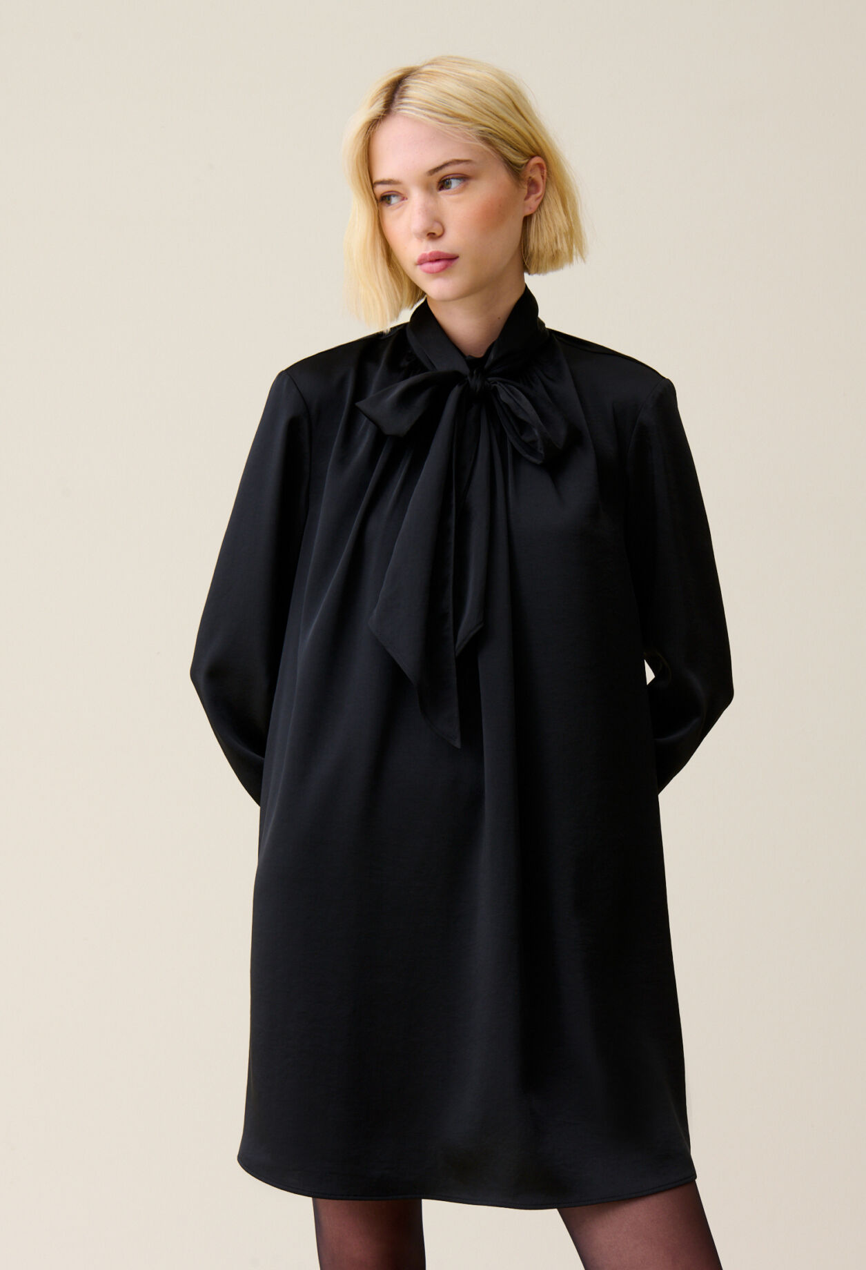 Flowing dress with black bow collar