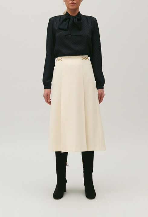 Mid-length ivory skirt with curb chain