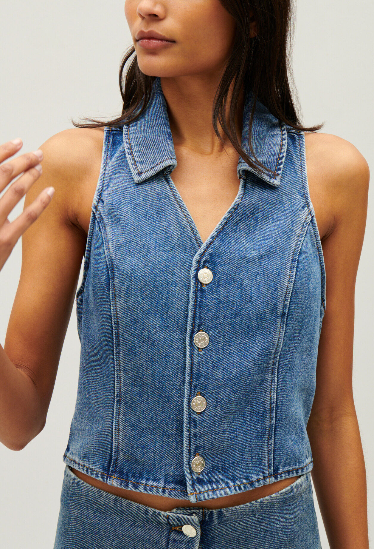 Blue denim sleeveless top