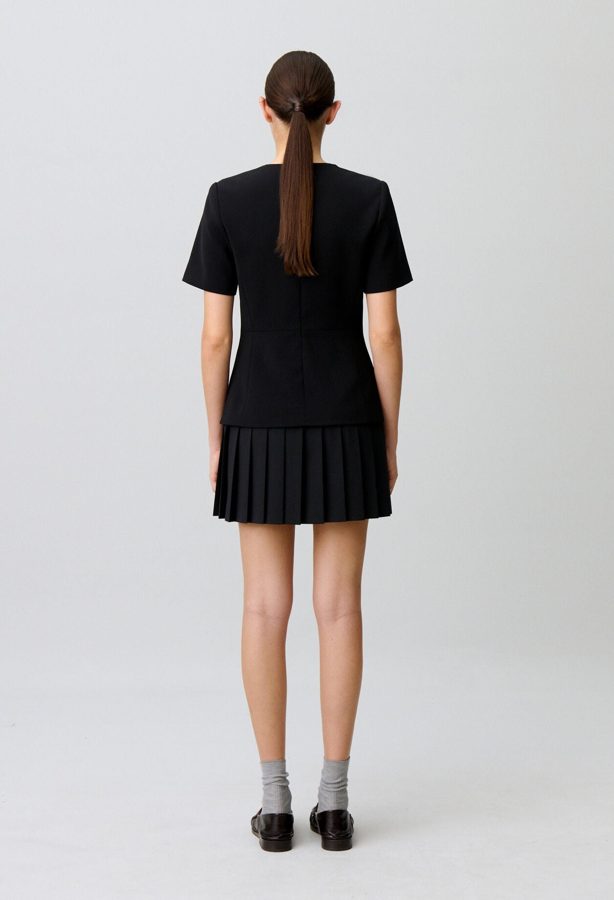 Short pleated peplum dress