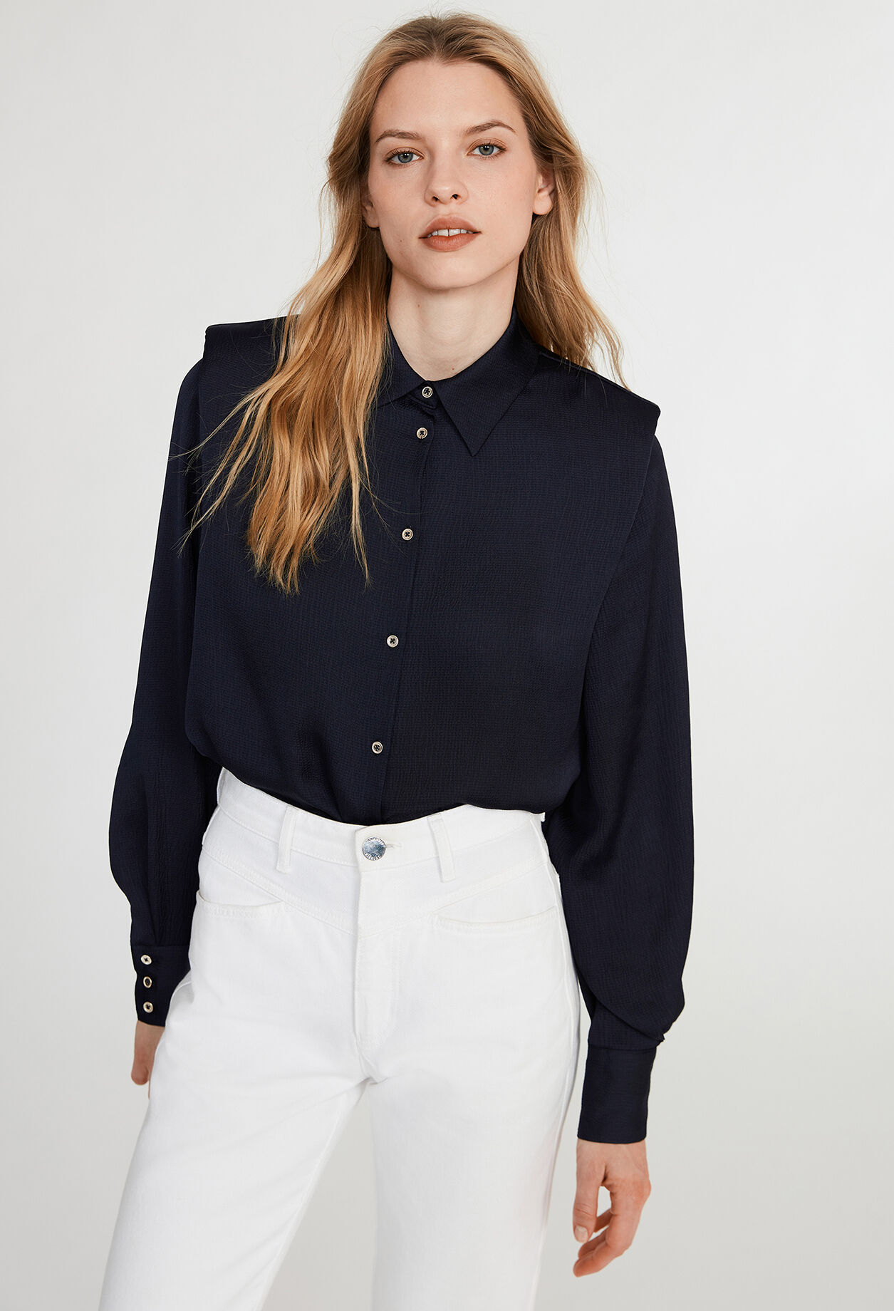 Shirt with shoulder pads